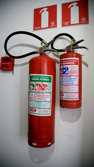 salvador, bahia / brazil - june 29, 2020: extinguisher for fire is seen in corridor of residential building in the city of Salvador.