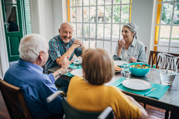 istock Four senior people having dinner together 1254698456