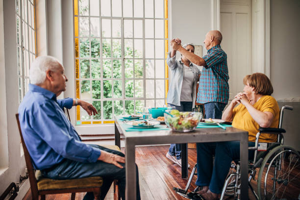 istock Four senior people having dinner party 1254701200