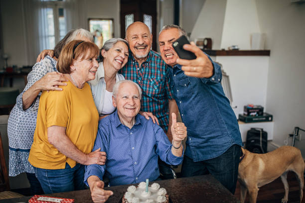 istock Senior people taking a selfie on birthday party 1254702271