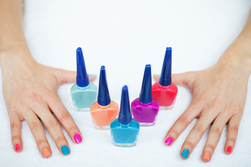 Female hands with different manicure colors - Lifestyles