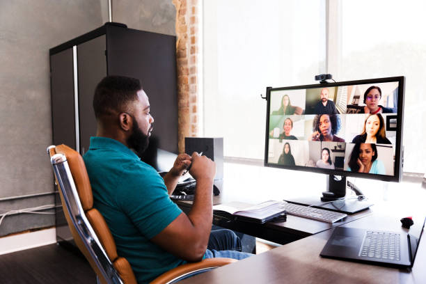 istock Mid adult manager video conferences with his team 1254705023