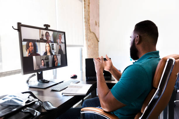 istock Male manager has meeting with employees through video conferencing 1254705025