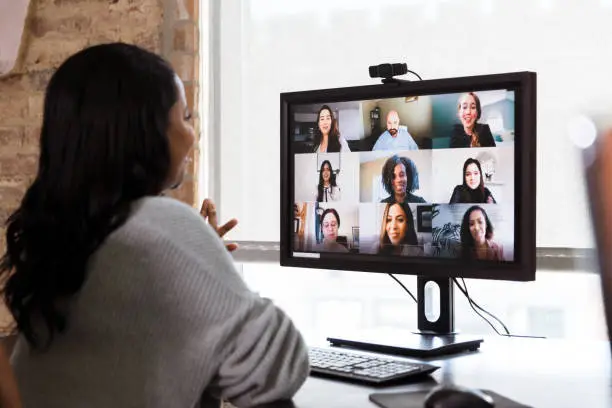 Photo of Multi-ethnic team has meeting via video conference