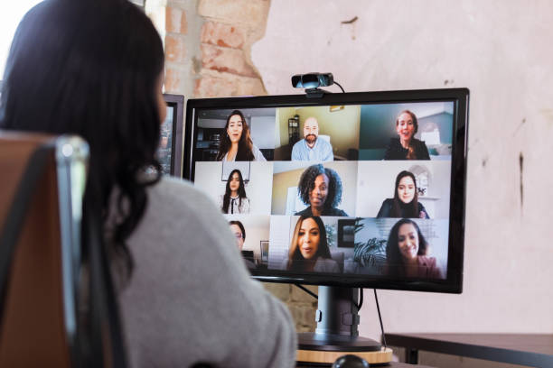 istock Unrecognizable female manager meets with team via teleconference 1254705205