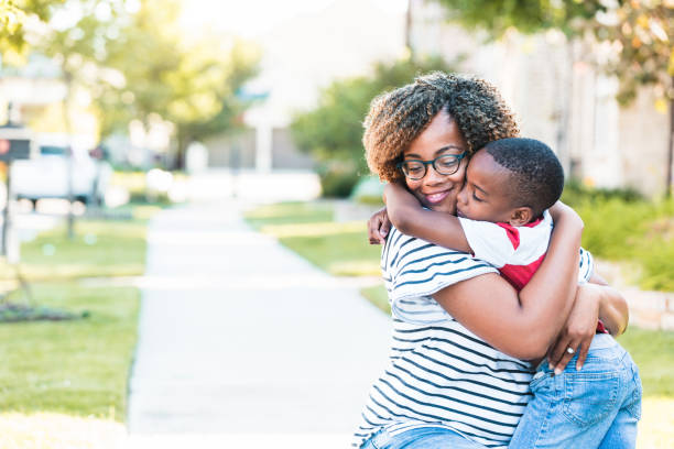 istock Young boy gives mom big hug during walk 1254705302