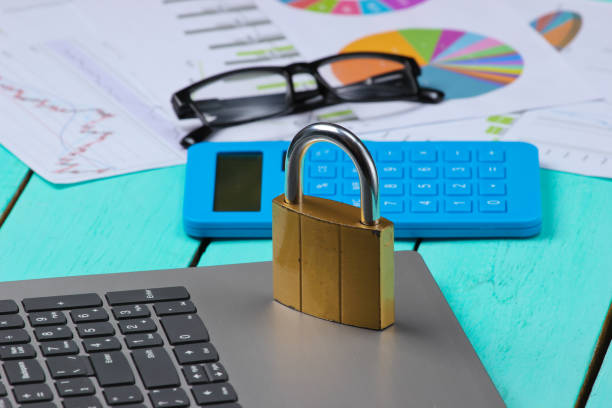 istock The lock on the keyboard. Hiding and protecting digital information. Graphs and charts 1254710542