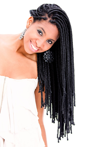 Black woman with dreadlocks facing camera smiling - Studio shot
