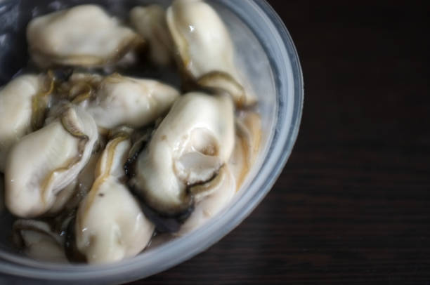 close up fresh oyster in cup , thai seafood - pacific oyster imagens e fotografias de stock