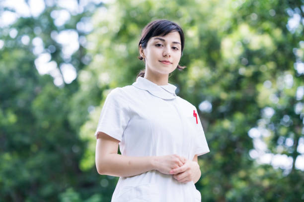 istock young woman posing in white coat 1254714143