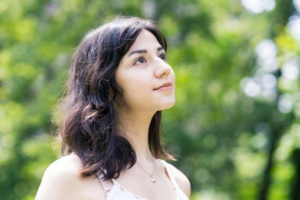 istock A young woman showing a relaxed expression 1254715004