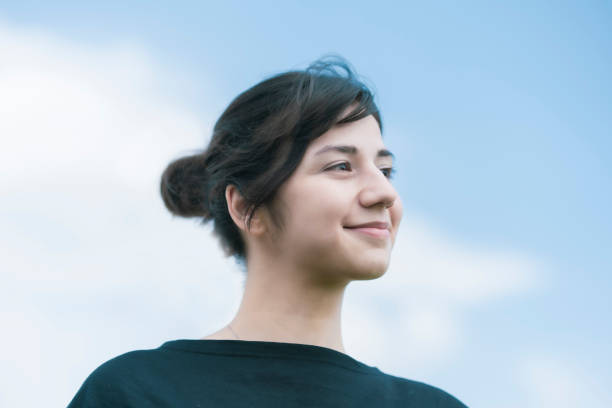 istock A young woman showing a relaxed expression 1254715062