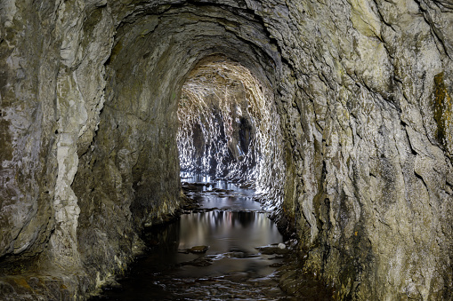 Yellow Bank Creek draining through the man-made tunnel (drilled in 1907-1908) in the Santa Cruz Mudstone.