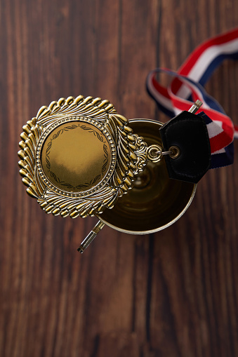 top view of award trophy on the wood background