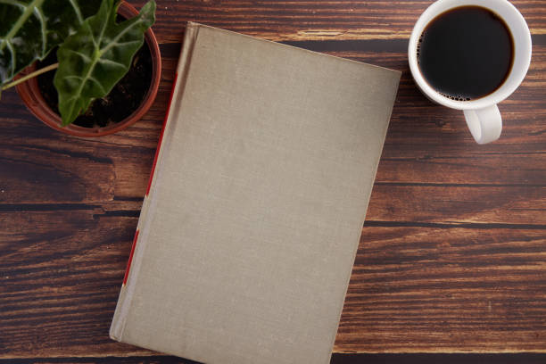 blank hard cover book on wood table