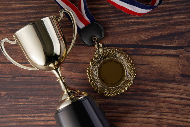 istock trophy on wood background 1254723774