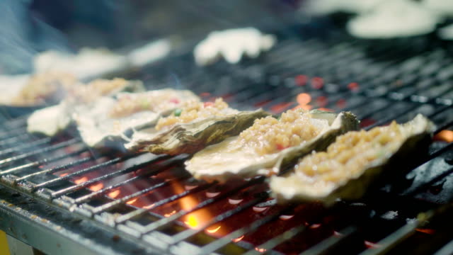 Roast oysters sold at night market