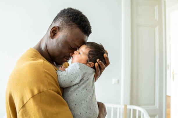 istock Father embracing cute baby boy 1254725571