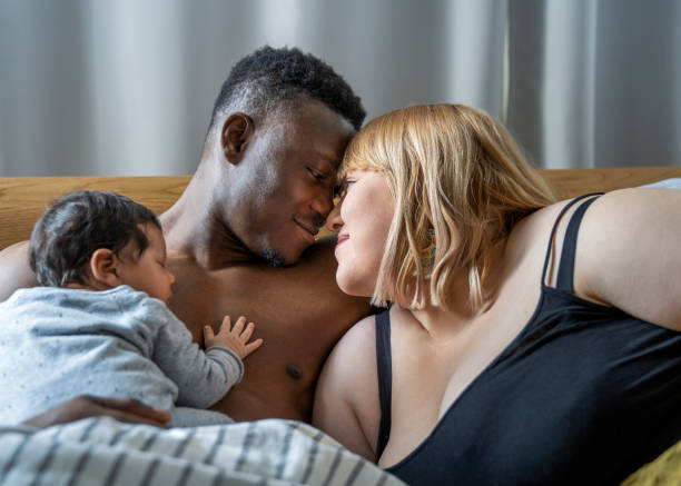 istock Romantic couple with baby boy at home 1254726816