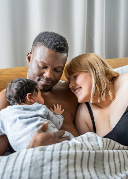 istock Couple with baby boy at home 1254726883