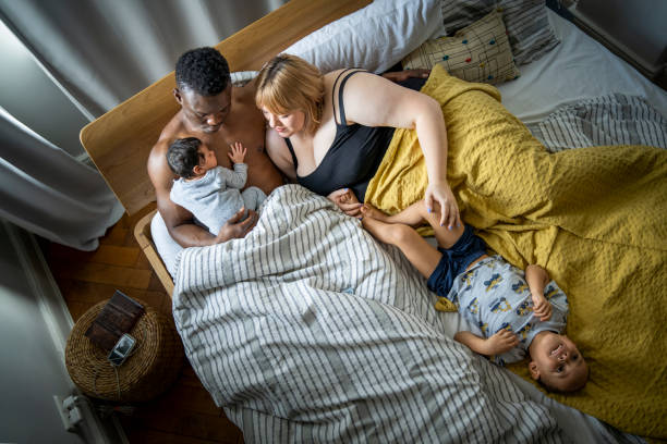 istock Family relaxing on bed at home 1254727024