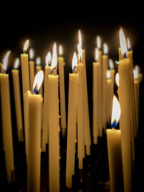 istock burned candle sticks over black in a church 1254728278