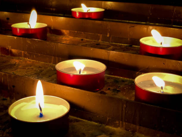 istock candle ligths in a church 1254729995