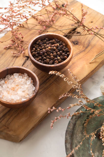 istock Black pepper and spice concept in wooden bowl 1254730309