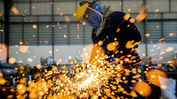 istock Steel grinding workers on structures in the factory. Construction concept . 1254732619