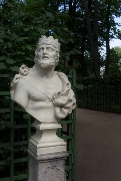Saint-Petersburg, Russia - July 28, 2019: Marble Sculpture of the bust of King Midas by Orazio Marinali, Italy, 1717. Summer Garden, St. Petersburg, Russia. The most famous King Midas is popularly remembered in Greek mythology for his ability to turn everything he touched into gold.