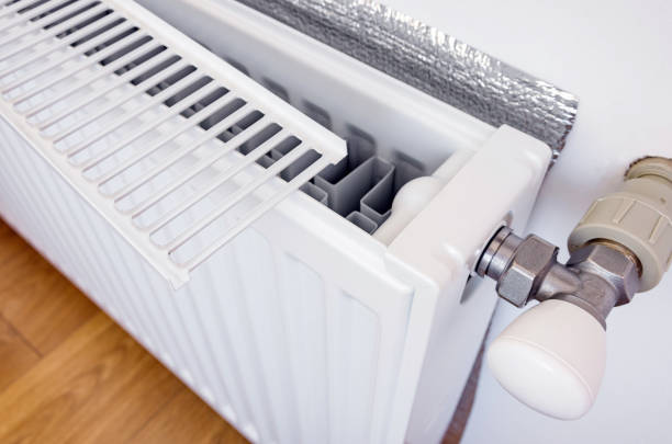 istock White heating radiator with grill removed for cleaning and repair 1254742012