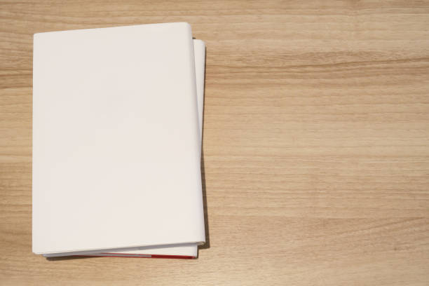 istock A stack of books on a wooden desk 1254742721