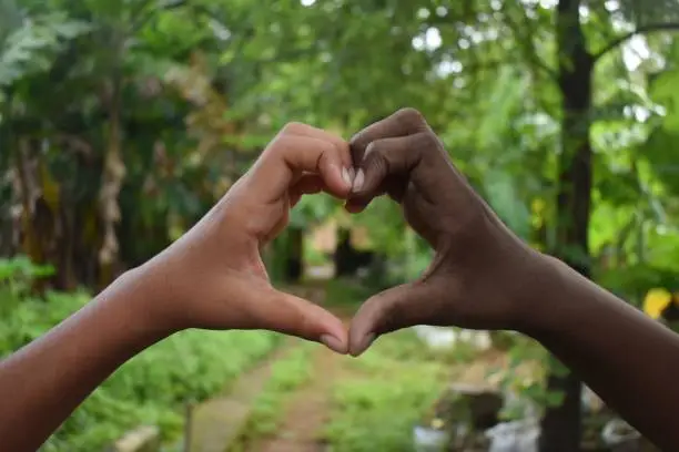 Black and white hands in heart shape, interracial friendship. protest.