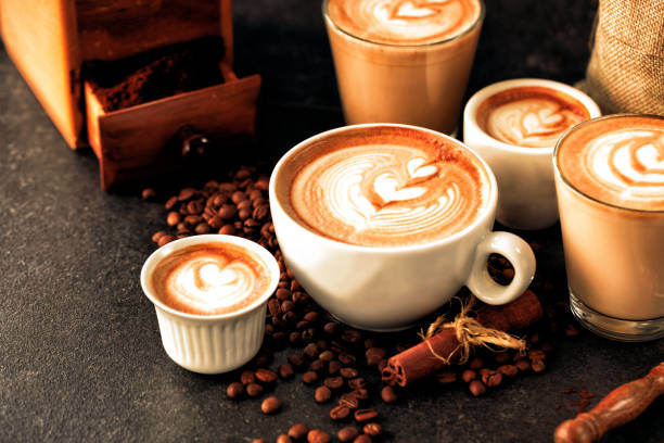 Caffe latte and a bunch of coffee beans