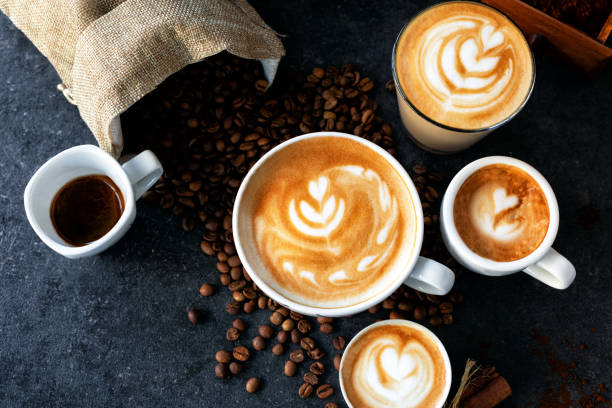 istock Espresso and coffee cups with coffee beans in background 1254748213