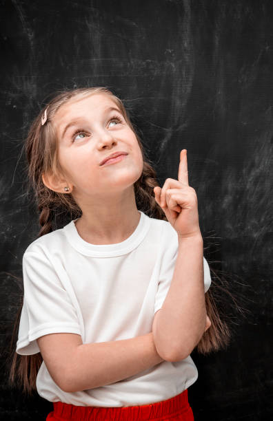 istock Cute little girl with idea 1254748796