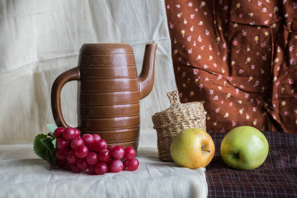 Still life with grapes, apples and a jug. High quality photo