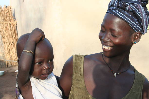 Afro caribbean woman posing with her son