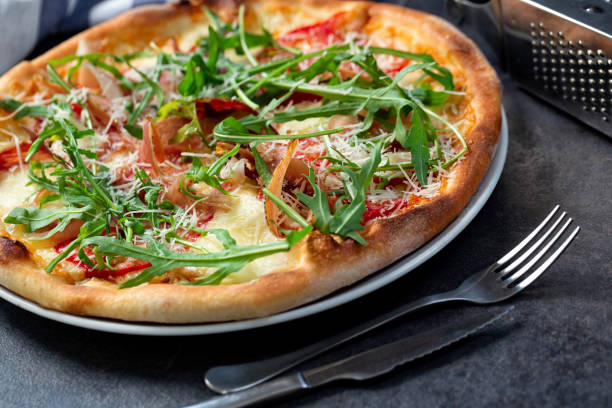 istock Pizza meal alongside with cutlery 1254749699