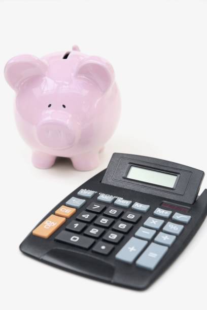 istock Calculator and a piggy bank 1254750443