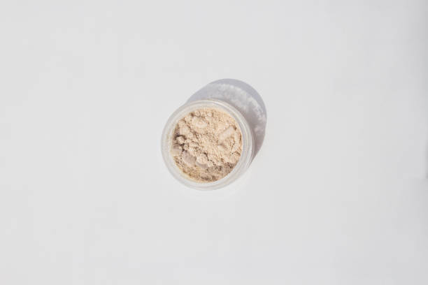 istock Blusher, eyeshadow and transparent face powder on white background with copy space, close-up. 1254751226