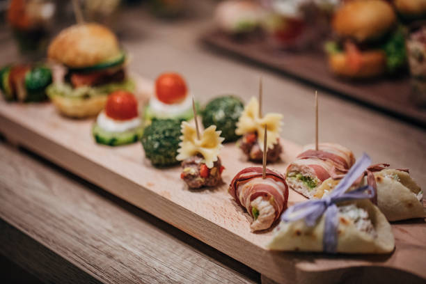 istock Canapes appetizers on wooden table 1254754412