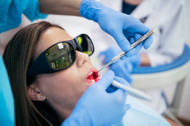 istock Woman Getting Professional Teeth Whitening. 1254756291