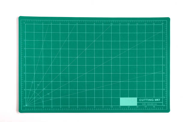 istock Green grid cutting matt or pad on background. 1254757747