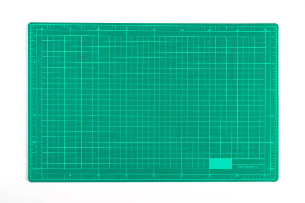 istock Green grid cutting matt or pad on background. 1254757755