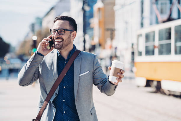 路上で電話で話しているビジネスマン - blazer outdoors portrait men ストックフォトと画像