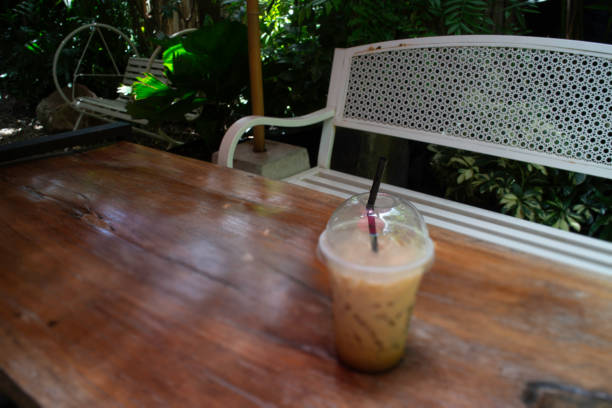 Iced coffee drink in resort garden, stock photo