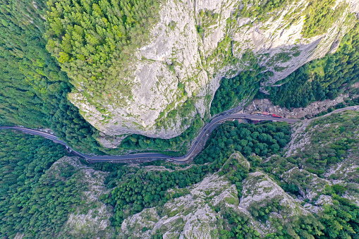 Narrow canyon viewed from above, aerial view of road on mountain valley, Bicaz Gorges in Romania from above