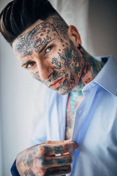 istock Portrait of modern tattooed man 1254761081