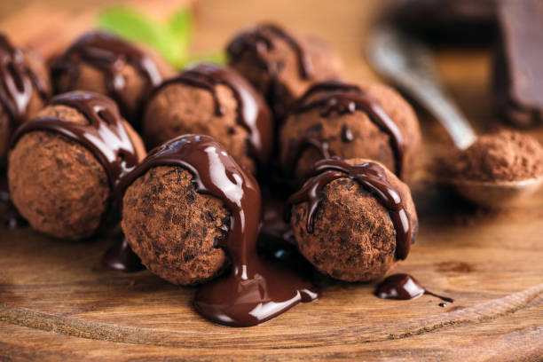 Homemade chocolate candy truffles glazed with chocolate ganache